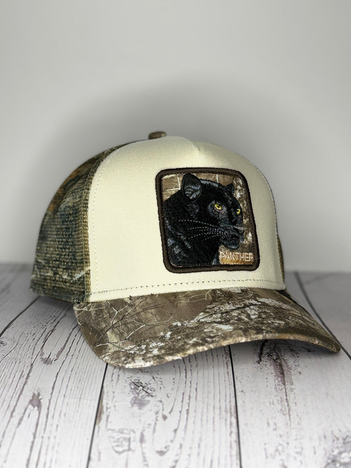 Goorin Bros Black Panther trucker hat cream and camo angled view